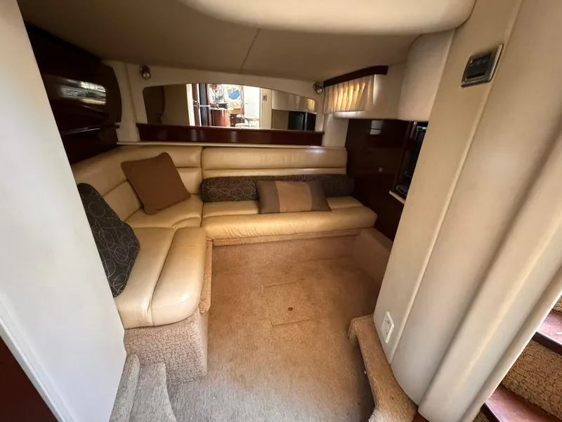 Slide: The Image of Interior of 2008 Sea Ray Sundancer yacht with beige seating and cushions. - 11