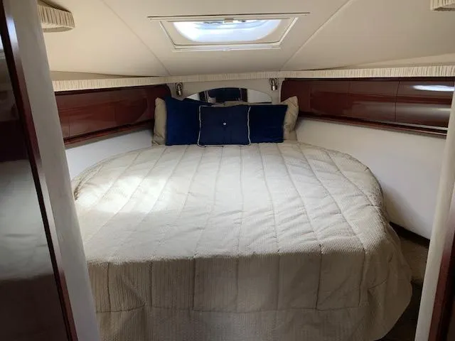 Slide: The Image of Luxurious cabin interior of a 2008 Sea Ray Sundancer yacht with a cozy bed. - 12