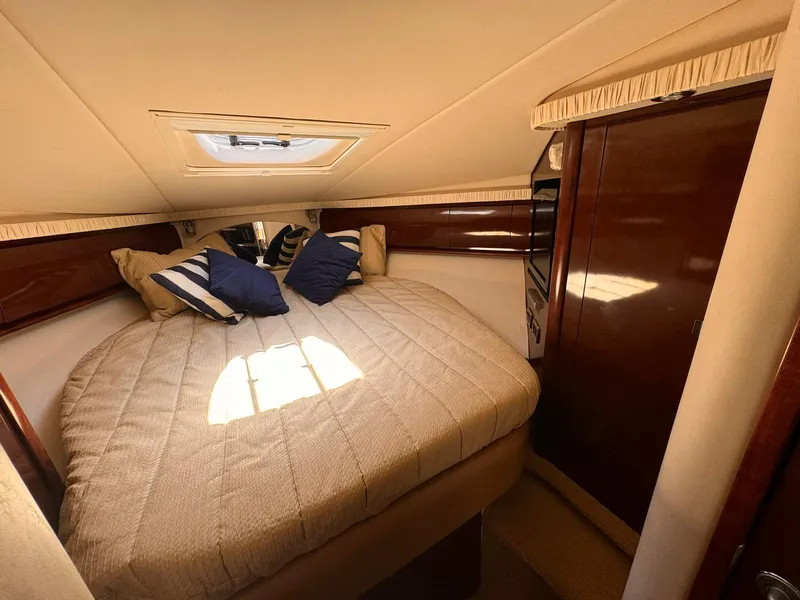 Slide: The Image of Luxurious cabin interior of 2008 Sea Ray Sundancer yacht with cozy bedding. - 13