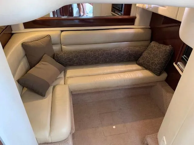 Slide: The Image of Luxurious 2008 Sea Ray Sundancer cabin interior with plush seating and decorative cushions. - 17