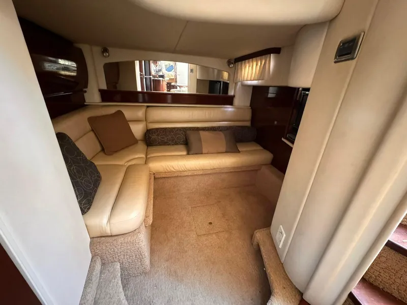 Slide: The Image of Luxurious interior of a 2008 Sea Ray Sundancer yacht with beige seating and cushions. - 19