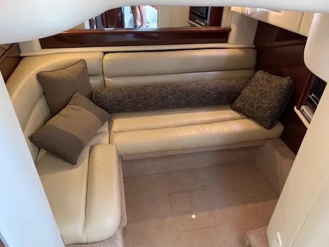 Slide: The Image of 2008 Sea Ray Sundancer interior with beige leather seating and decorative cushions. - 20