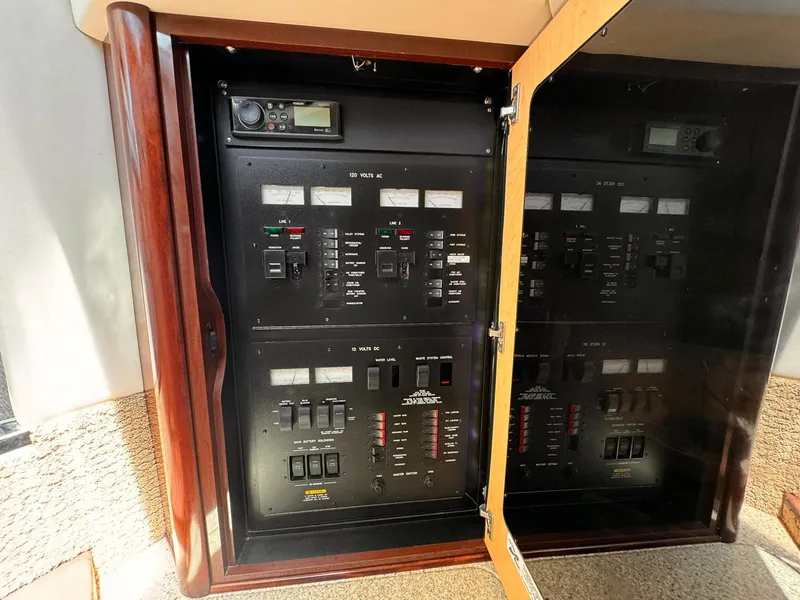 Slide: The Image of Electrical control panel inside a 2008 Sea Ray Sundancer boat, featuring various switches and meters. - 30