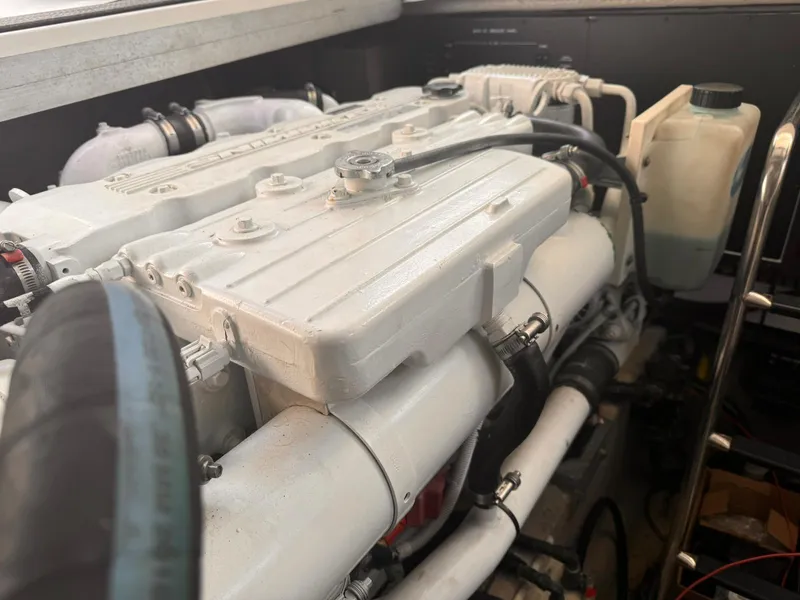 Slide: The Image of Engine compartment of a 2008 Sea Ray Sundancer boat, showcasing detailed mechanical components. - 31