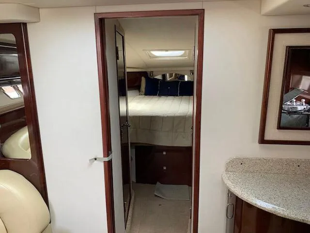 Slide: The Image of Interior cabin of 2008 Sea Ray Sundancer yacht with bed and modern furnishings. - 32