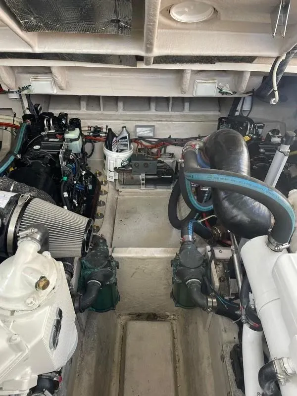 Slide: The Image of Engine room of a 2008 Sea Ray Sundancer boat, showcasing mechanical components and systems. - 35