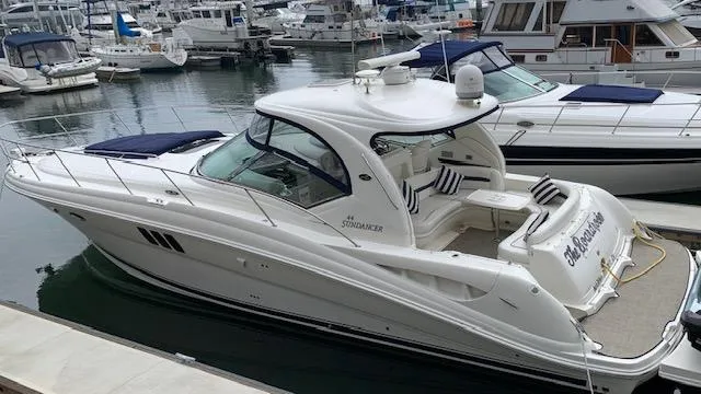 Slide: The Image of 2008 Sea Ray Sundancer yacht docked in marina, surrounded by other boats. - 37