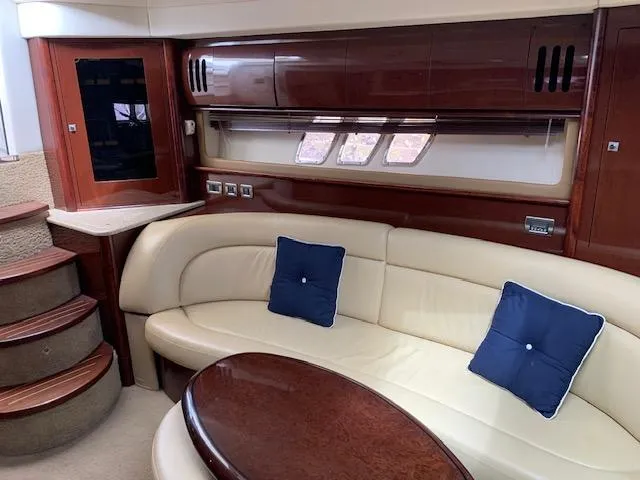 Slide: The Image of Luxurious interior of 2008 Sea Ray Sundancer yacht with leather seating and wooden accents. - 5