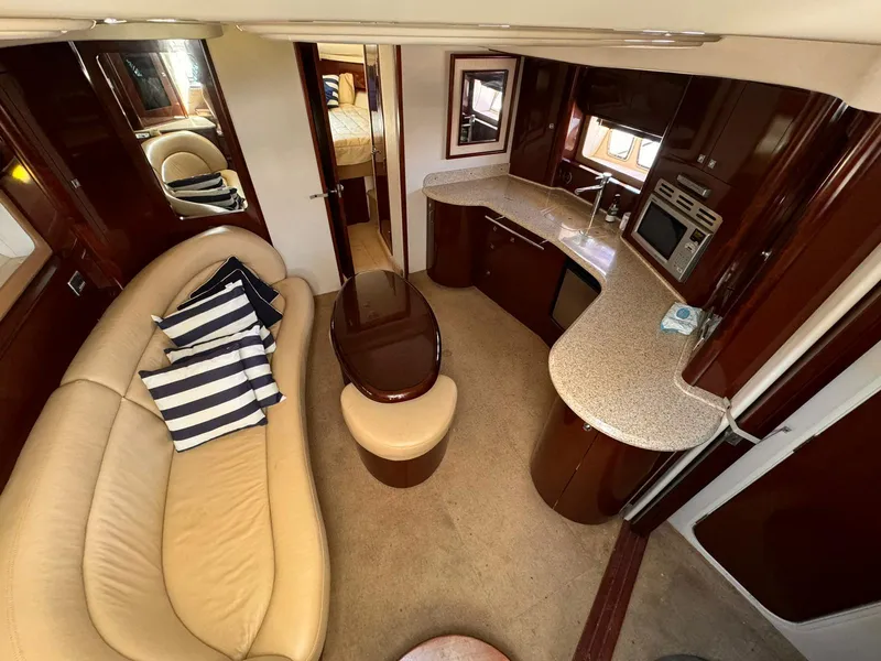 Slide: The Image of Luxurious 2008 Sea Ray Sundancer interior with elegant seating and modern kitchen amenities. - 7