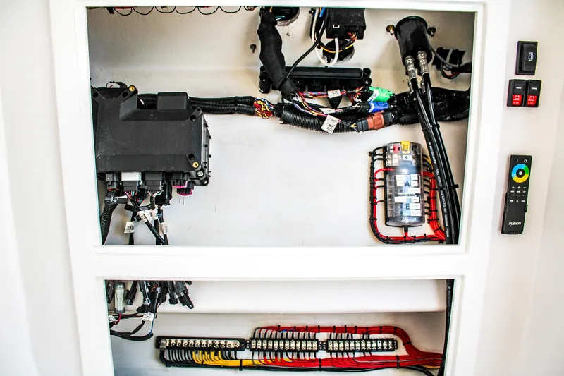 Slide: The Image of Electrical panel of 2026 Invicta 320 CC boat with wiring and controls. - 12