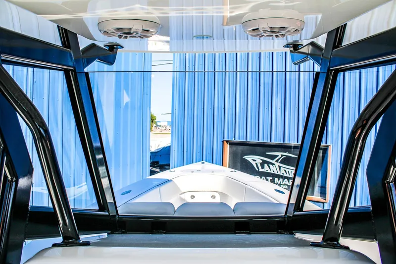 Slide: The Image of Interior view of 2026 Invicta 320 CC boat with blue exterior background. - 14