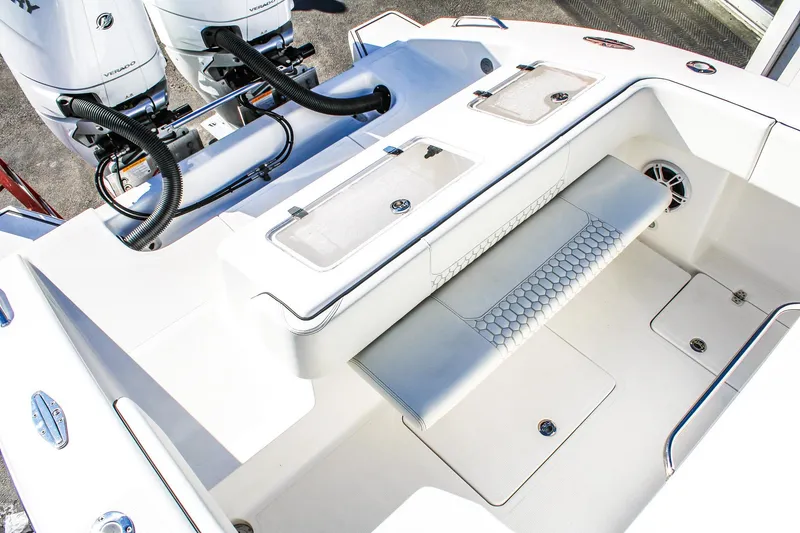 Slide: The Image of 2026 Invicta 320 CC boat interior with dual engines and seating area. - 4