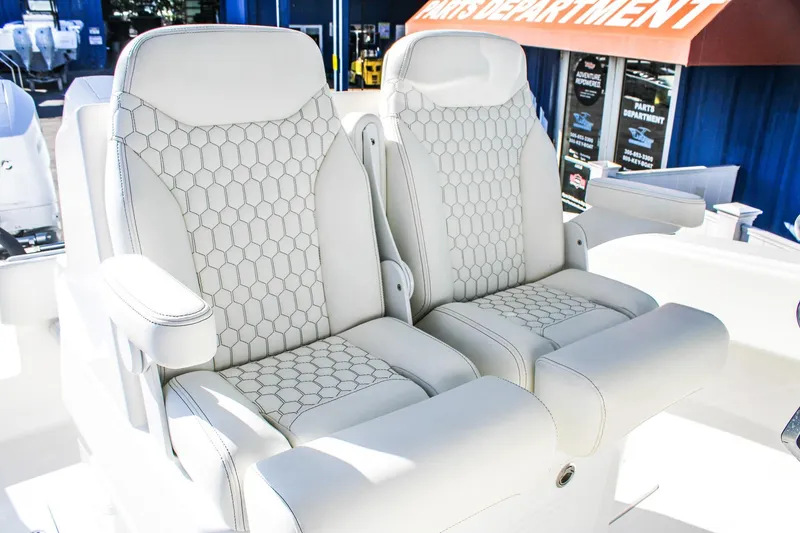 Slide: The Image of Luxurious seating on 2026 Invicta 320 CC boat with hexagonal pattern upholstery. - 9