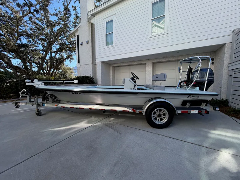 Slide: The Image of 2021 Maverick 17 HPX-S boat on trailer in front of house. - 1