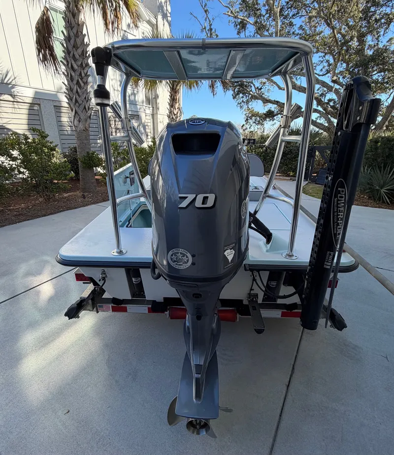 Slide: The Image of Rear view of a 2021 Maverick 17 HPX-S with 70 HP outboard motor. - 12