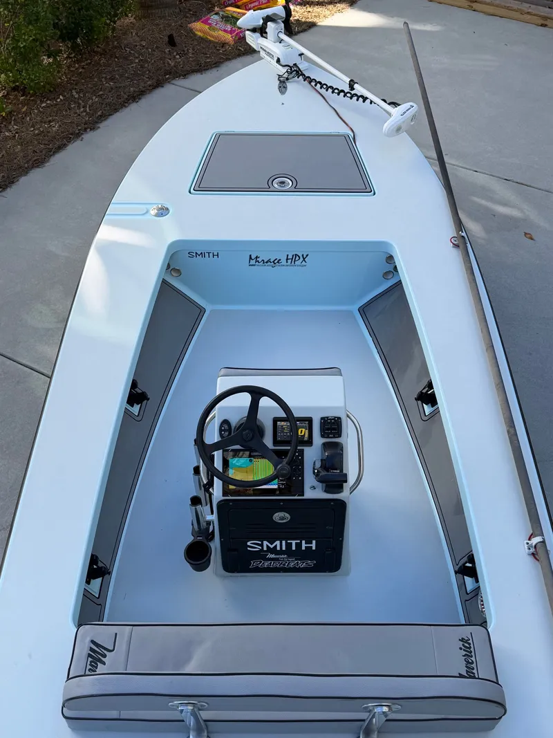 Slide: The Image of 2021 Maverick 17 HPX-S boat with steering console and seating area. - 14