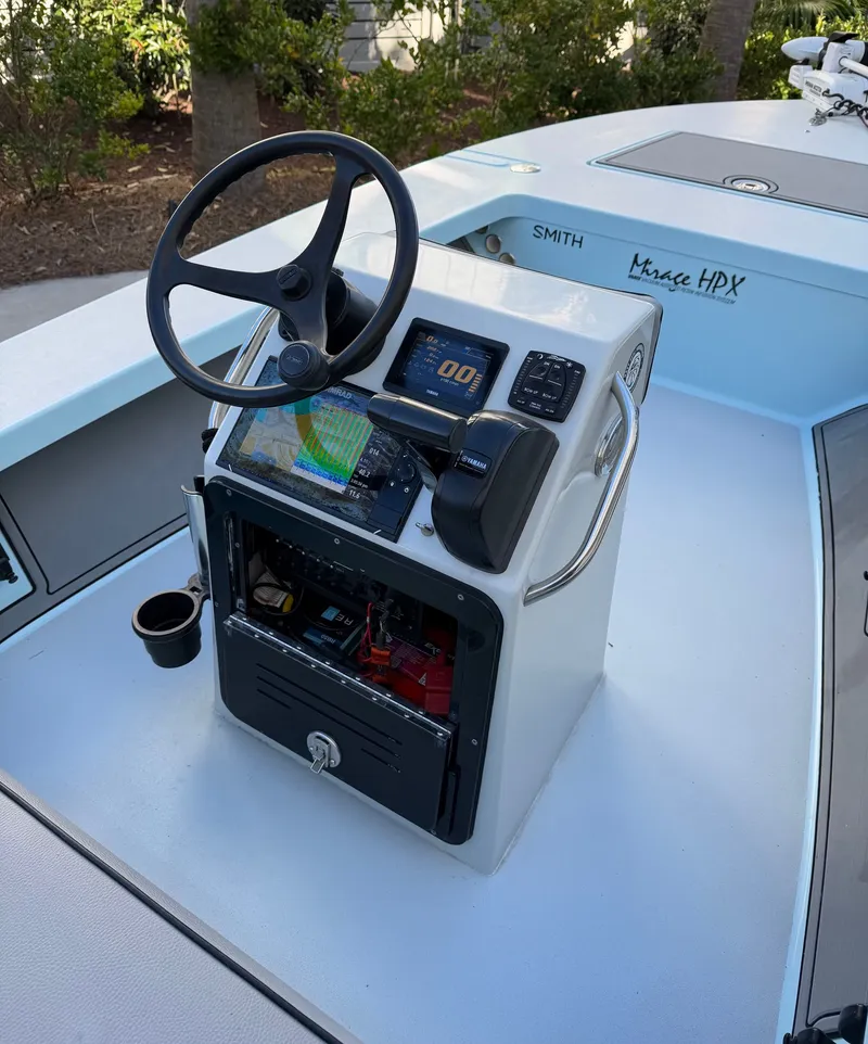 Slide: The Image of Control console of a 2021 Maverick 17 HPX-S boat. - 17