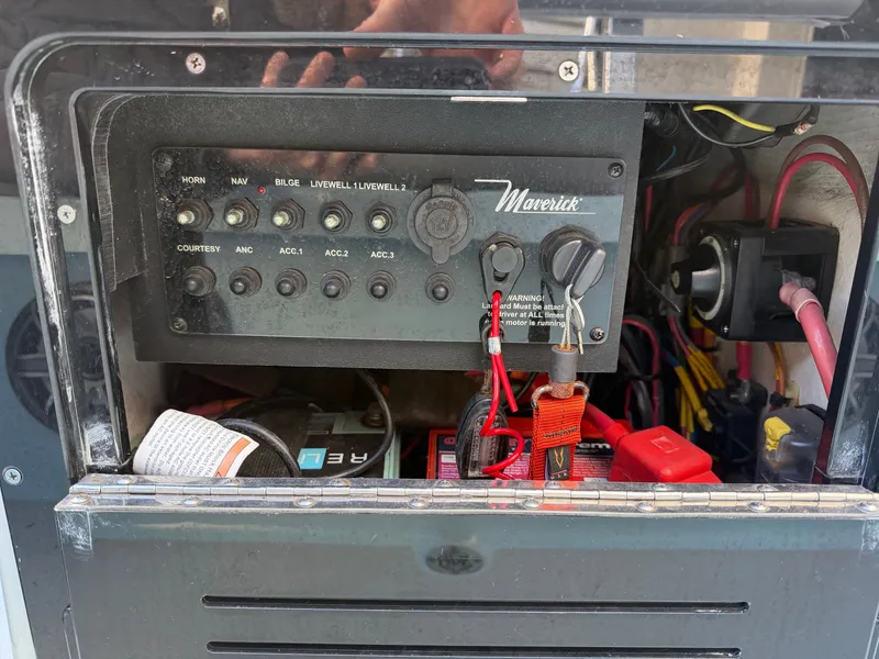 Slide: The Image of Control panel of a 2021 Maverick 17 HPX-S boat. - 19