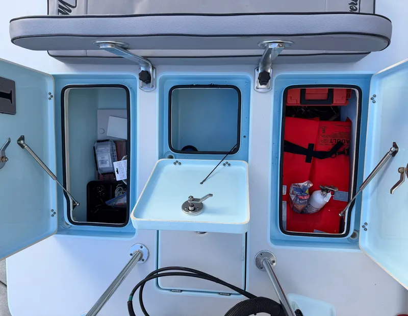 Slide: The Image of Interior view of a 2021 Maverick 17 HPX-S boat with storage compartments. - 23