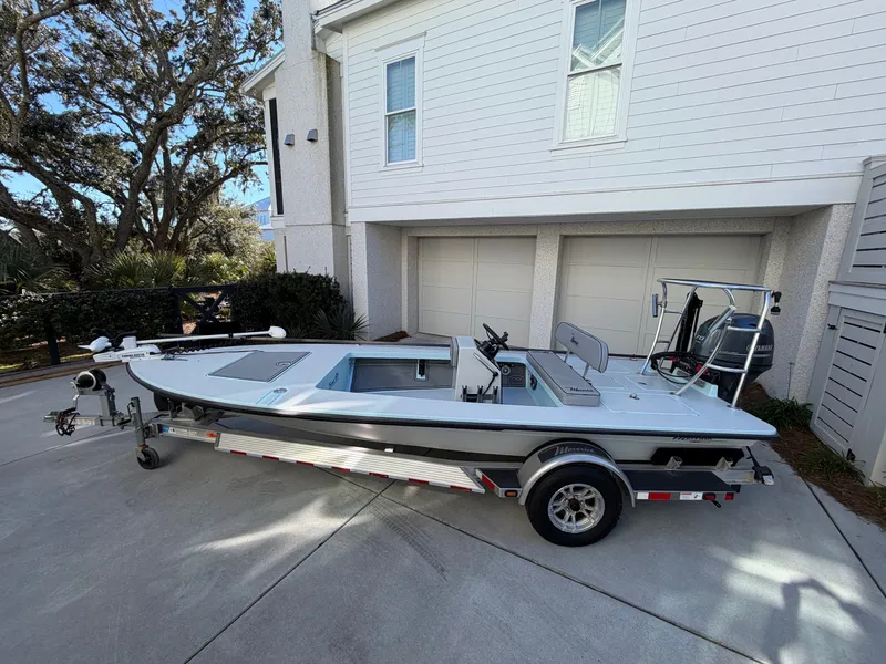 Slide: The Image of 2021 Maverick 17 HPX-S boat on trailer in front of garage. - 3