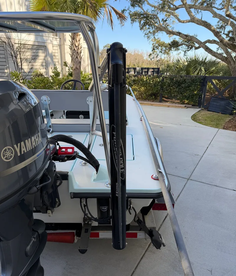 Slide: The Image of 2021 Maverick 17 HPX-S boat with Yamaha motor parked outdoors. - 30