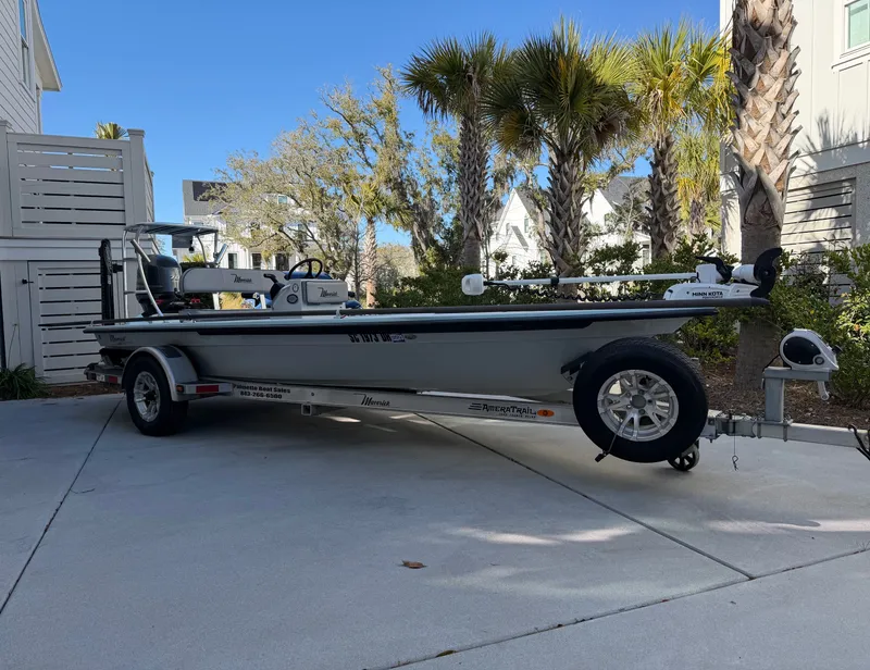 Slide: The Image of 2021 Maverick 17 HPX-S boat on trailer, surrounded by palm trees. - 5