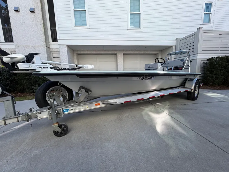 Slide: The Image of 2021 Maverick 17 HPX-S boat on trailer in front of building. - 7