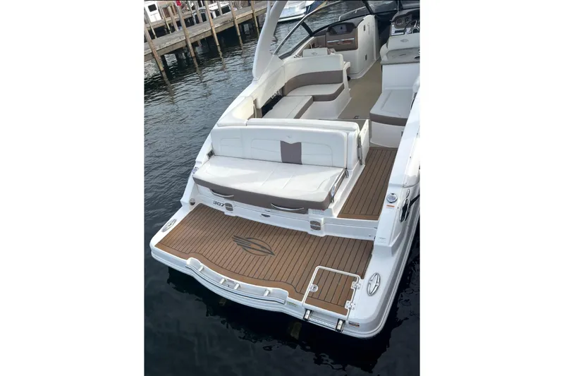 Slide: The Image of 2014 Chaparral 307 SSX boat with spacious seating and elegant deck design. - 10