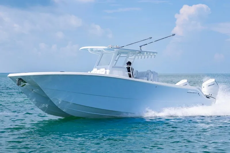 The Image of 2026 Invincible 33 Catamaran cruising on open water under clear skies. - 0