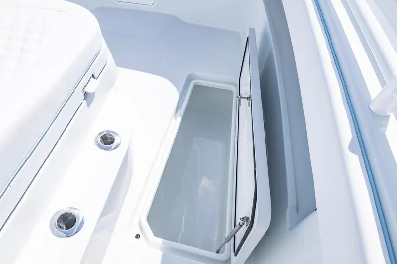 Slide: The Image of Open storage compartment on 2026 Invincible 33 Catamaran, showcasing sleek design and functionality. - 20