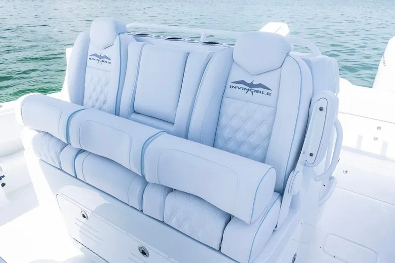 Slide: The Image of Luxurious seating on 2026 Invincible 33 Catamaran, featuring elegant white upholstery. - 24