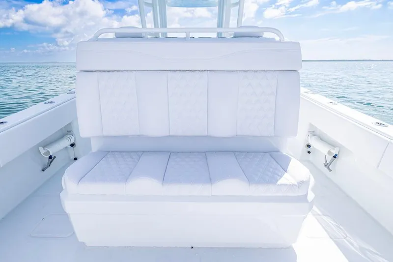 Slide: The Image of Luxurious seating on 2026 Invincible 33 Catamaran, featuring elegant white upholstery. - 27
