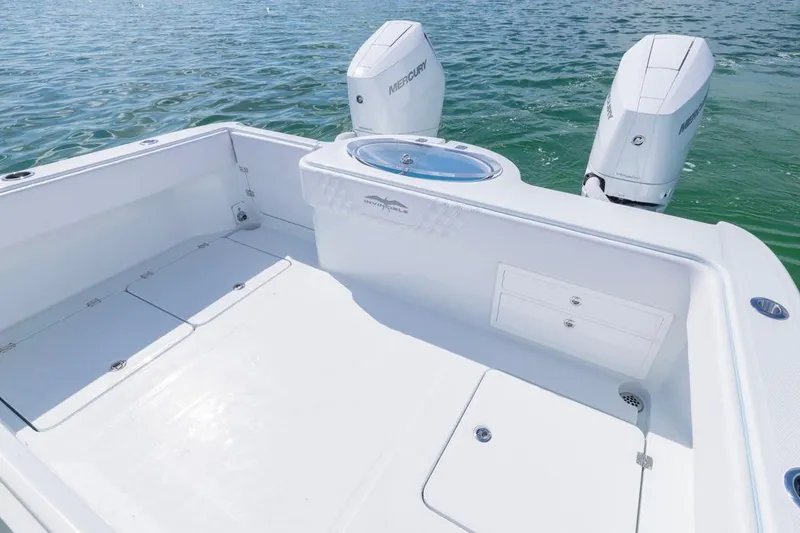 Slide: The Image of 2026 Invincible 33 Catamaran with dual Mercury engines on calm water. - 31