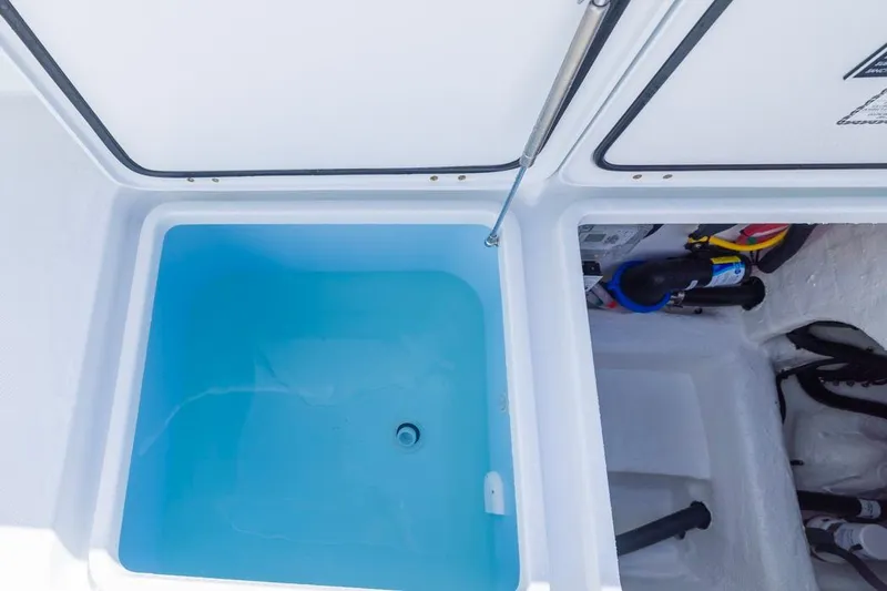 Slide: The Image of Livewell and storage compartment on 2026 Invincible 33 Catamaran boat. - 33