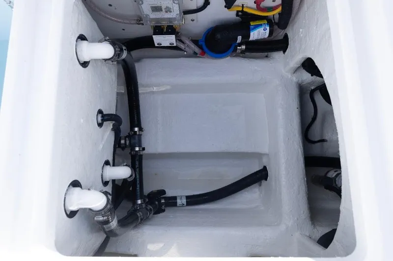 Slide: The Image of Bilge area of 2026 Invincible 33 Catamaran with visible plumbing and wiring. - 34