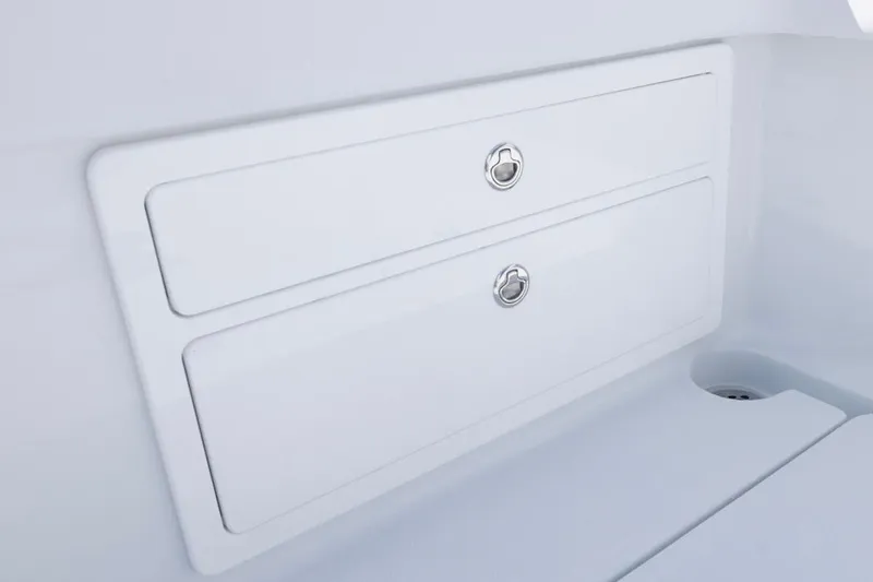 Slide: The Image of Storage compartments on 2026 Invincible 33 Catamaran, featuring sleek white design and secure latches. - 37