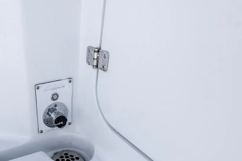 Slide: The Image of Close-up of 2026 Invincible 33 Catamaran interior detail with hinge and control panel. - 39