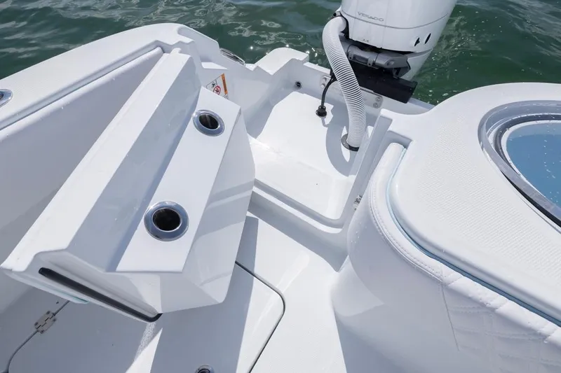 Slide: The Image of 2026 Invincible 33 Catamaran boat interior with rod holders and engine detail. - 40