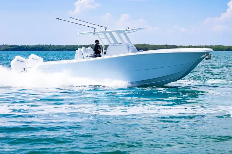 Slide: The Image of 2026 Invincible 33 Catamaran cruising on open water, showcasing sleek design and powerful engines. - 8