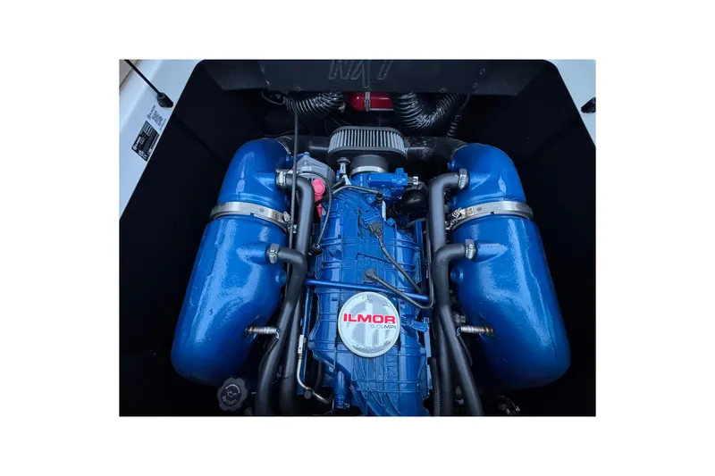 Slide: The Image of 2023 MasterCraft NXT22 Ilmor engine, blue components, detailed view. - 27