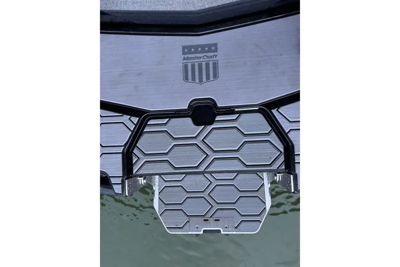 Slide: The Image of 2023 MasterCraft NXT22 boat platform with hexagonal pattern design. - 28