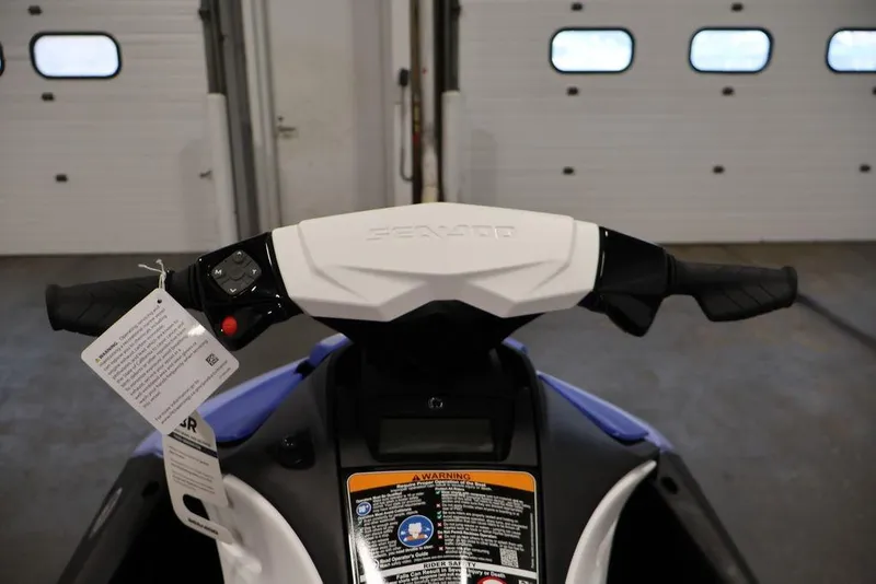 Slide: The Image of 2026 Sea-Doo Spark for 2 handlebars in a garage setting. - 16