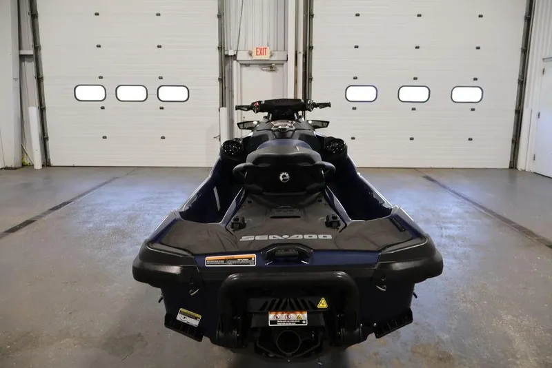 Slide: The Image of 2026 Sea-Doo GTX 170 jet ski in a garage, rear view. - 10