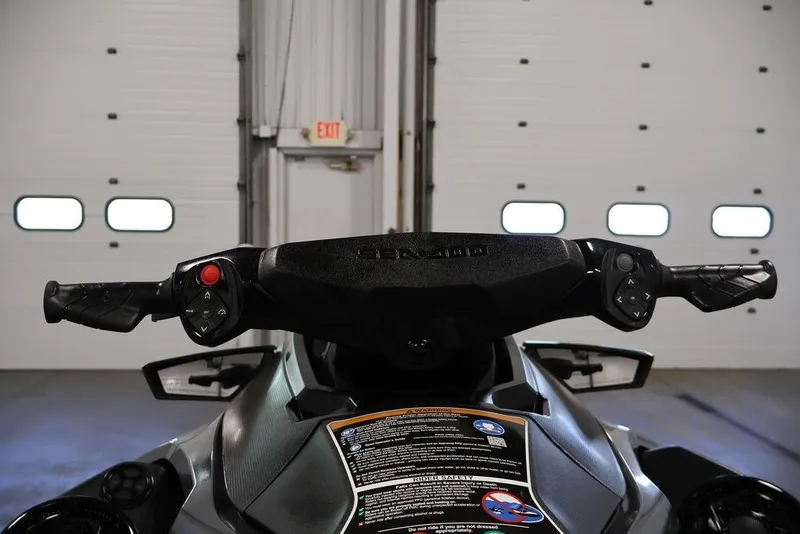 Slide: The Image of 2026 Sea-Doo GTX 170 handlebars and controls in a garage setting. - 12