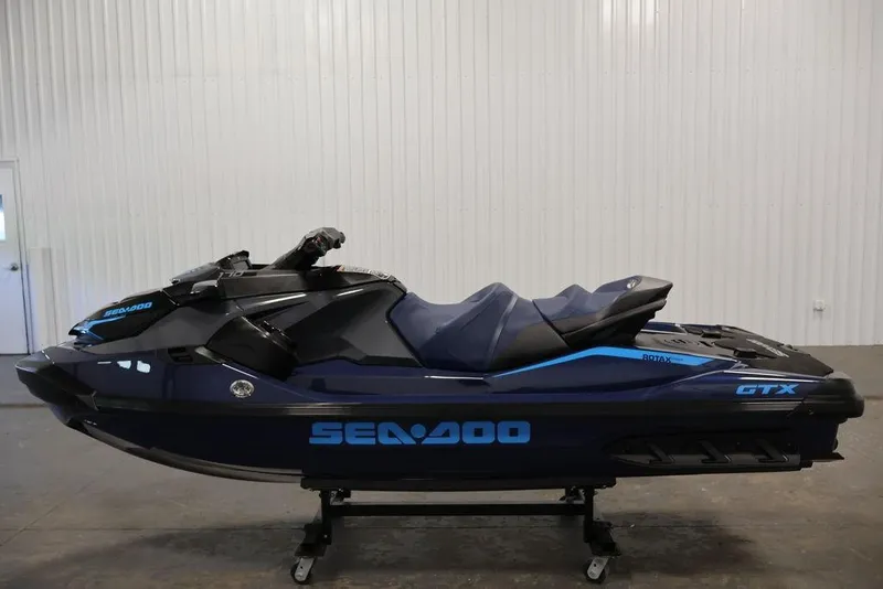 Slide: The Image of 2026 Sea-Doo GTX 170 jet ski in a showroom, featuring sleek design and modern features. - 13