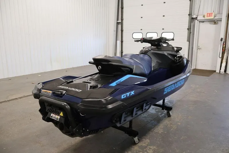 Slide: The Image of 2026 Sea-Doo GTX 170 jet ski in a garage, showcasing sleek design and modern features. - 5