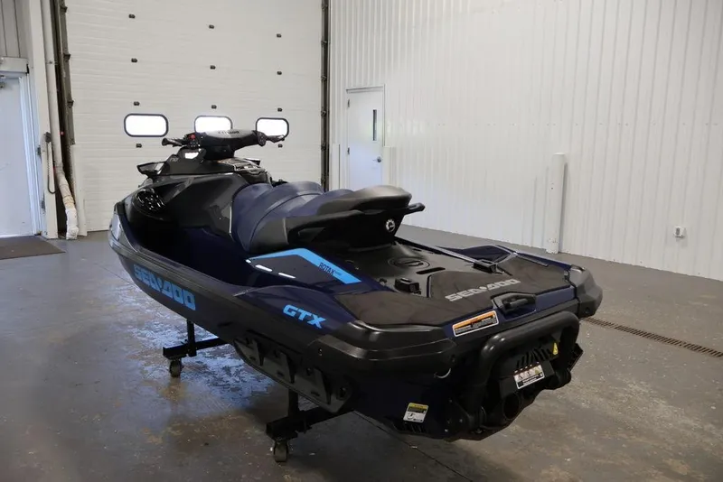 Slide: The Image of 2026 Sea-Doo GTX 170 jet ski in a garage, showcasing sleek design and modern features. - 8