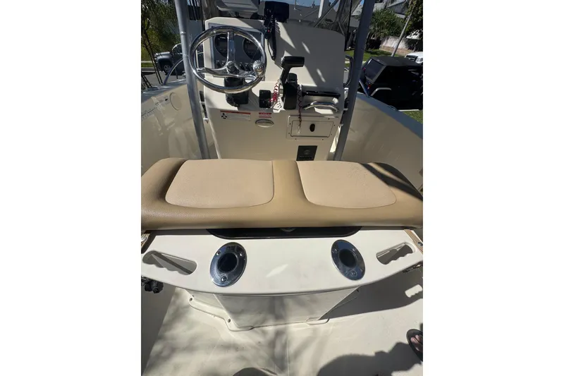 Slide: The Image of 2020 Scout 195 Sportfish boat interior with steering wheel and seating area. - 17
