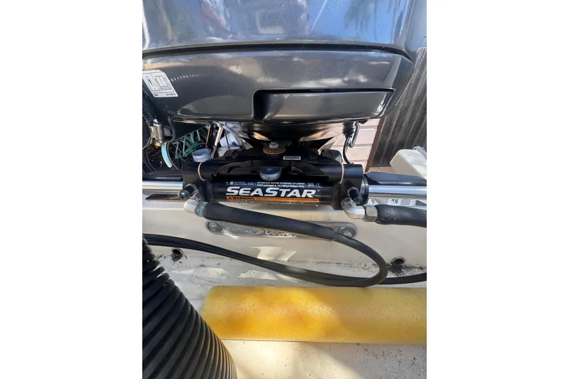 Slide: The Image of 2020 Scout 195 Sportfish boat engine with SeaStar hydraulic steering system. - 22