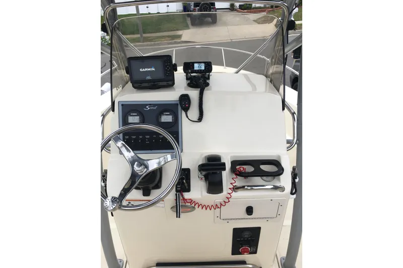 Slide: The Image of 2020 Scout 195 Sportfish boat console with Garmin navigation system and steering wheel. - 34